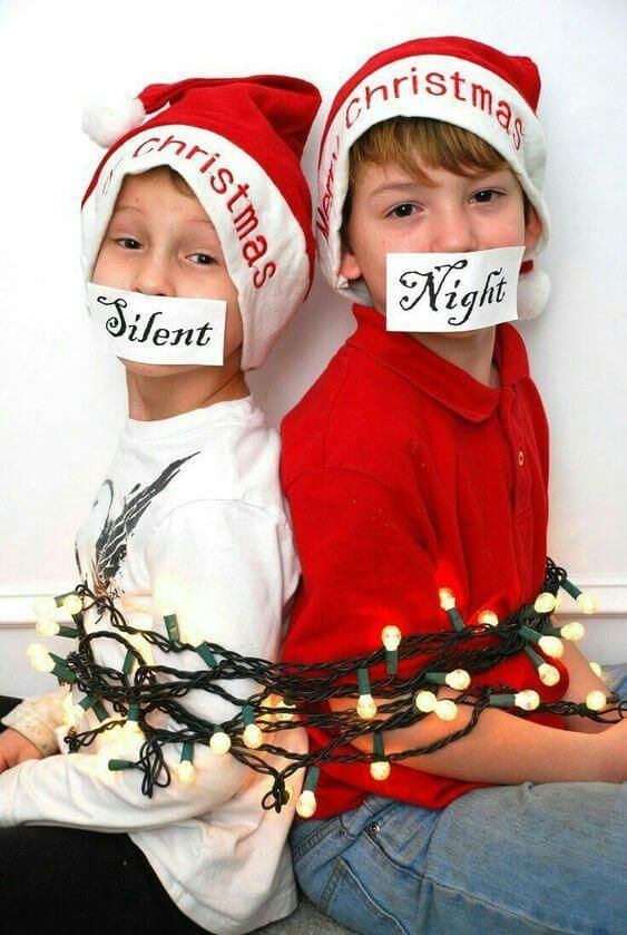 children tied up with christmas lights